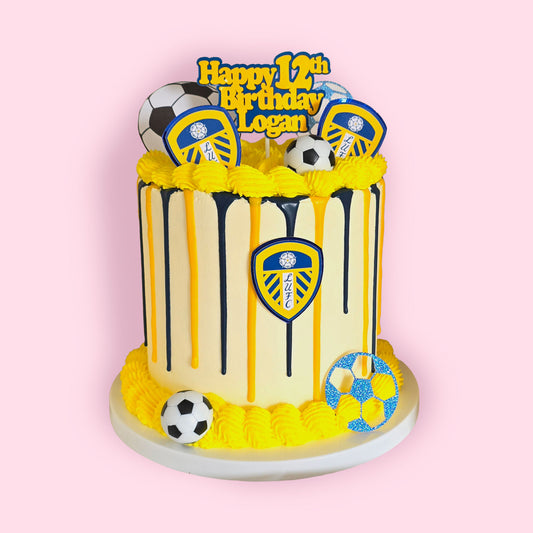 Custom Leeds United themed birthday cake with soccer toppers and yellow frosting drip for 12th birthday