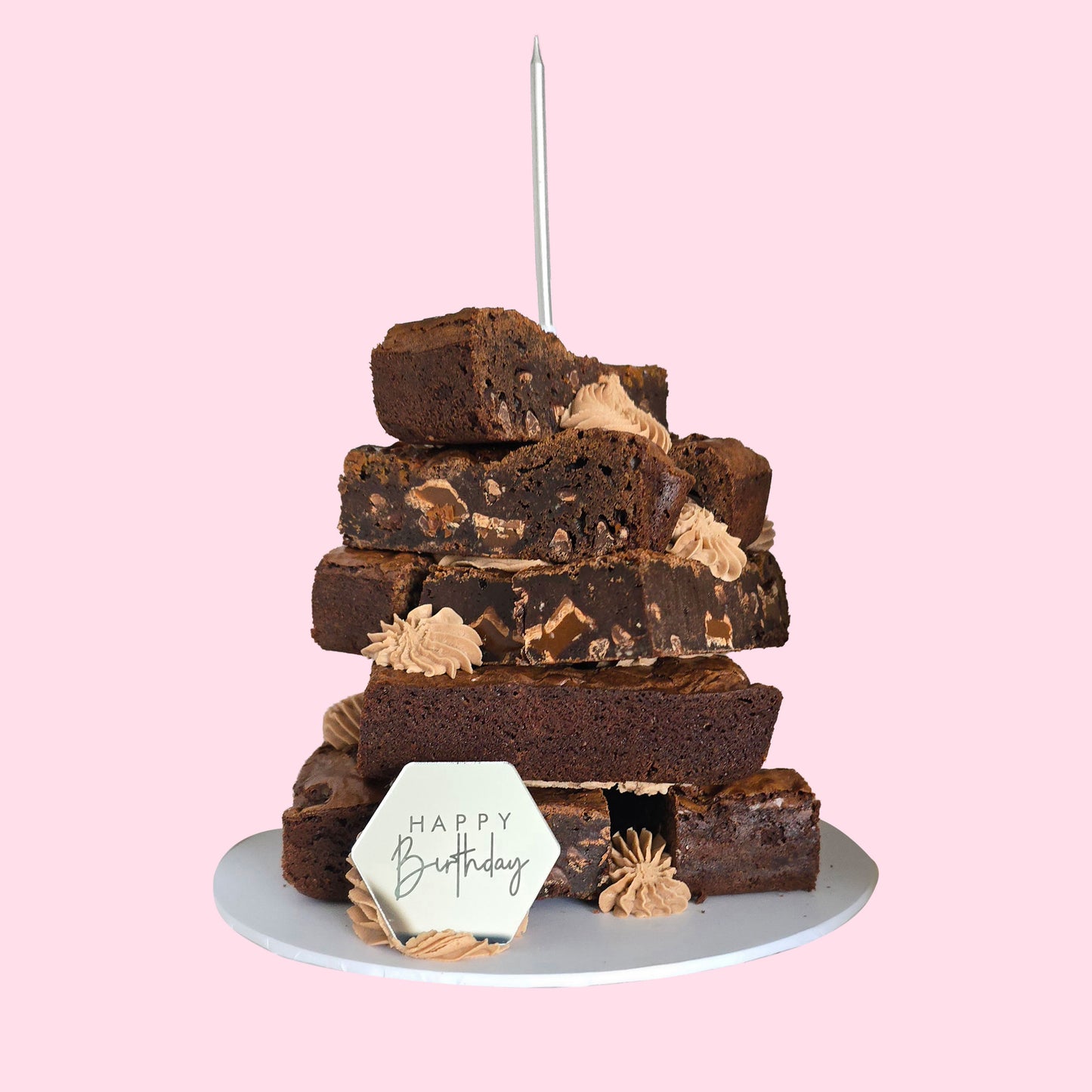 Layered chocolate brownie stack with Happy Birthday plaque and buttercream swirls, featuring assorted flavours